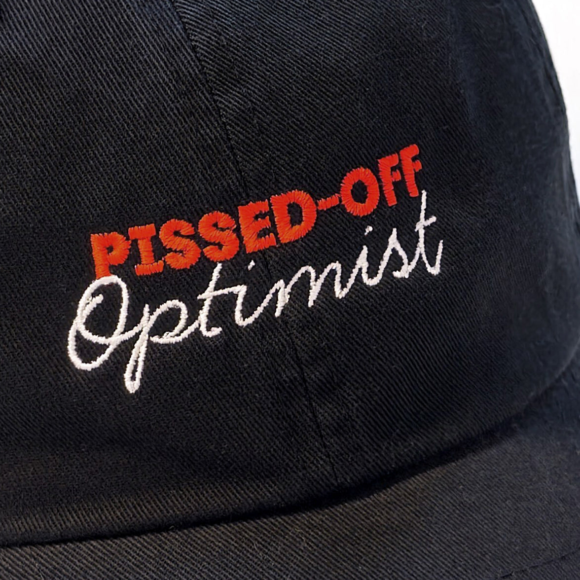 Black cap with 'Pissed-Off Optimist' text in red and white on a white background